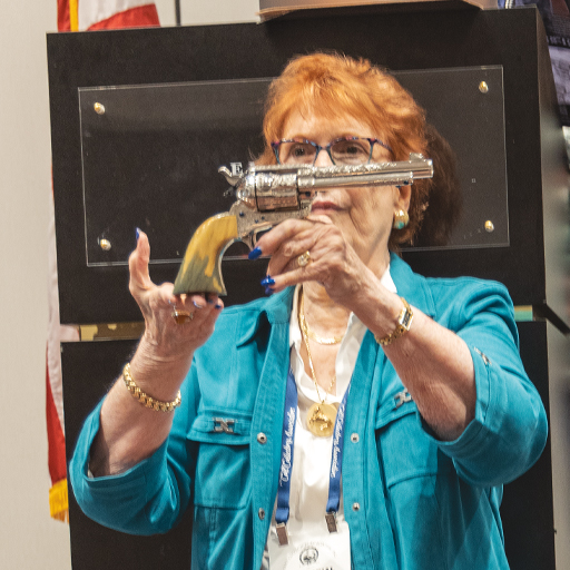 Carol Wilkerson presenting the ECLF Ladies' Gun during the raffle drawing at the 2021 Noblesville Show
